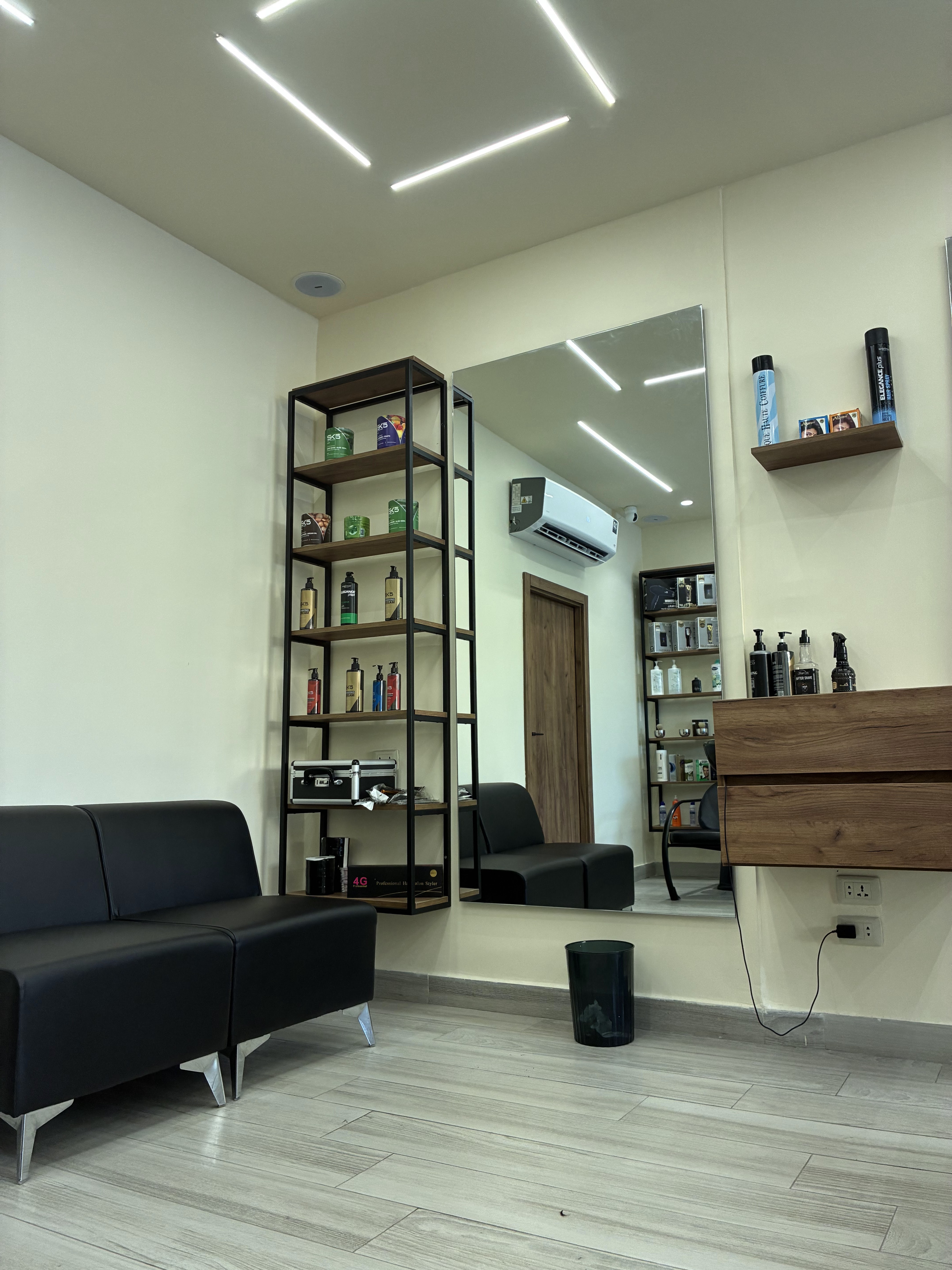 Shelves stocked with hair care and styling products at The Hairbin